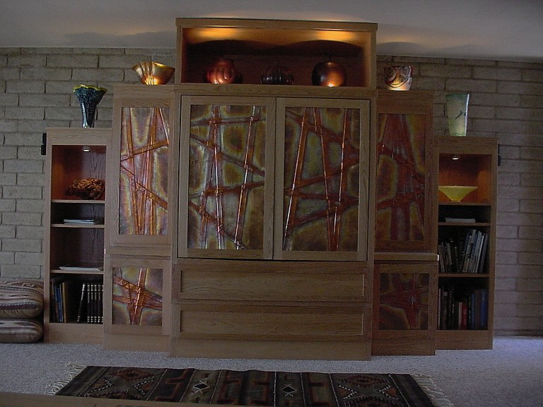 Entertainment Center with custom made copper oxide door panels